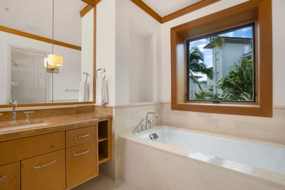 Gleaming chrome fixtures sing in harmony with warm cabinetry—practical, posh, and perfectly peaceful