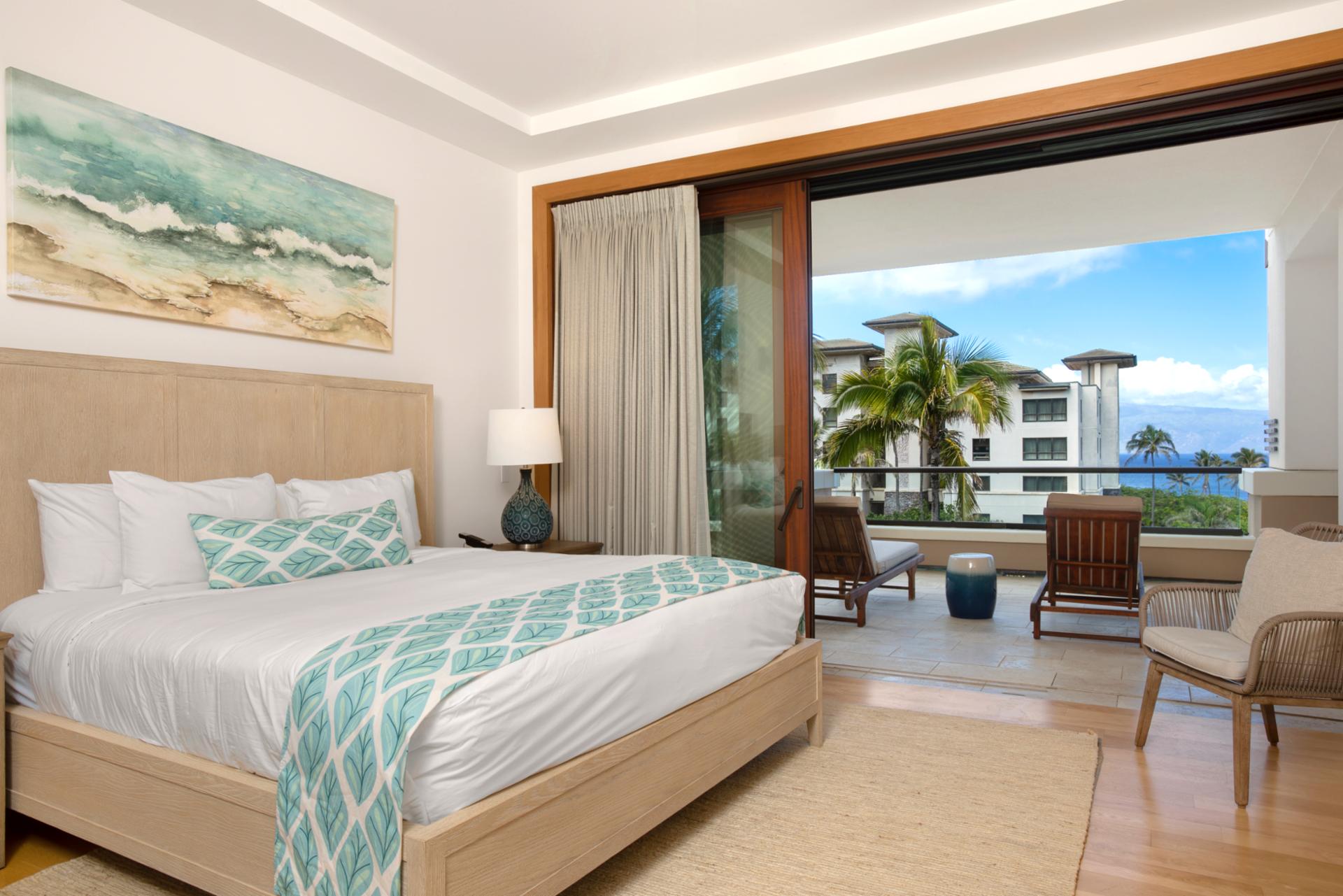 Floor-to-ceiling doors open to a private lanai, blending indoor luxury with breezy tropical views and golden light   
