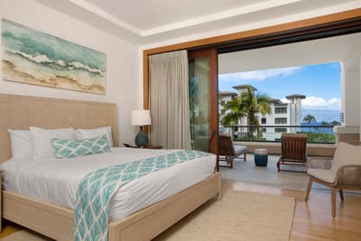 Floor-to-ceiling doors open to a private lanai, blending indoor luxury with breezy tropical views and golden light MON-6301