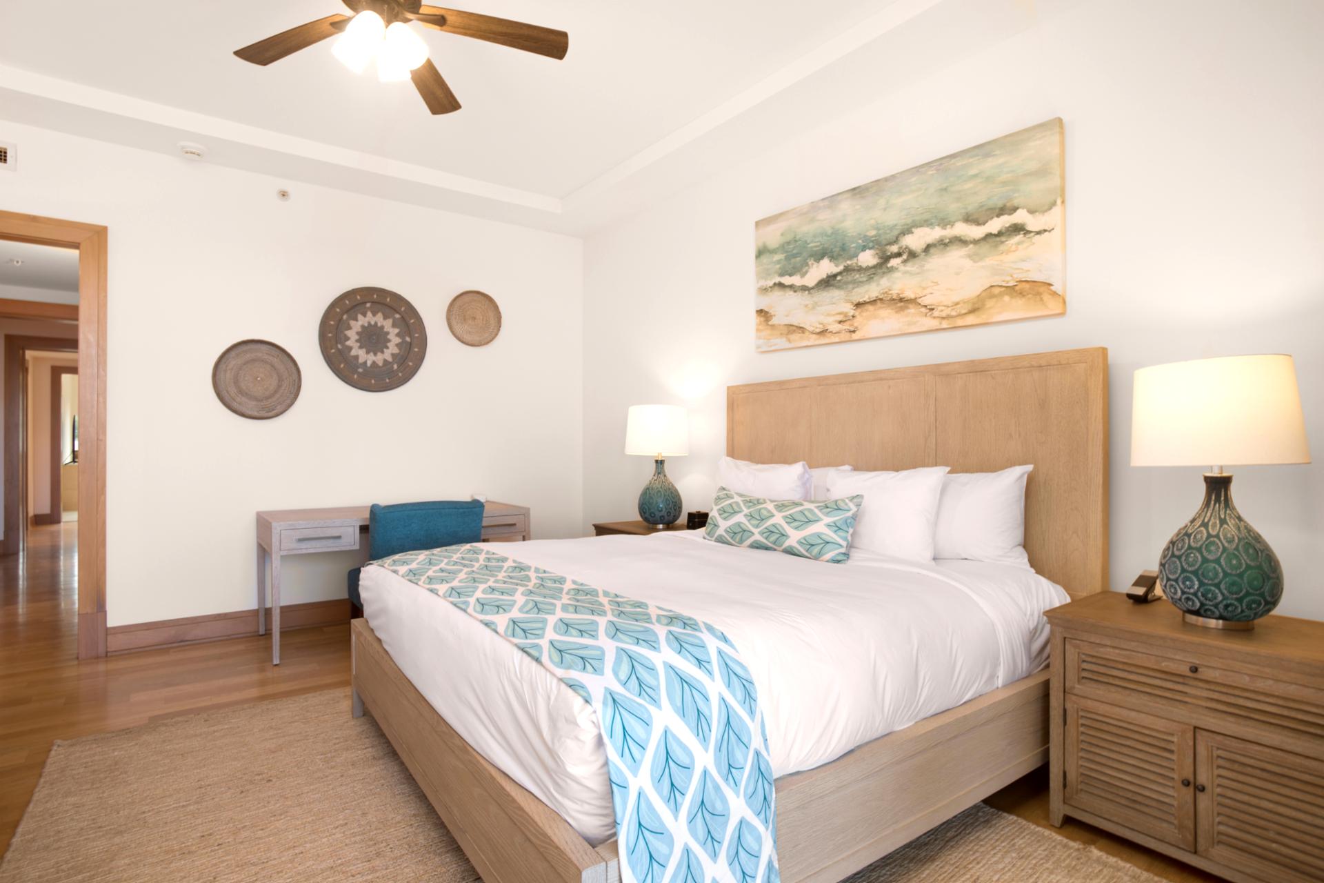 The king-size bed, adorned with cool aqua accents, offers an indulgent escape after sunlit island adventures   