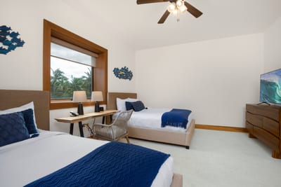 A central window draws the eye with its framed countryside view, offering a tranquil backdrop for serene rest MON-6301
