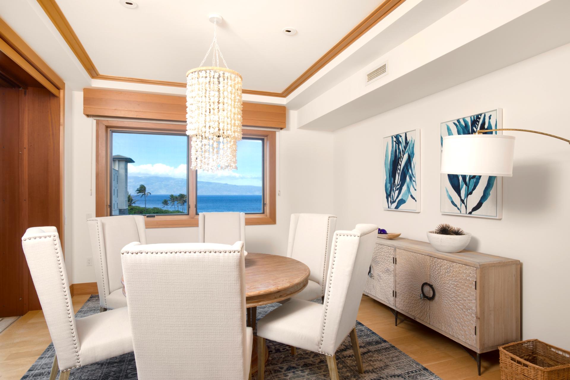    Seashell chandelier sparkles above, while the view beyond the window sings lullabies only the ocean knows