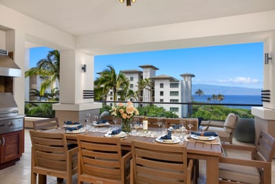 This lanai brings luxury outdoors—crisp linens, coastal blooms, and meals served with a side of sea breeze and views MON-6301