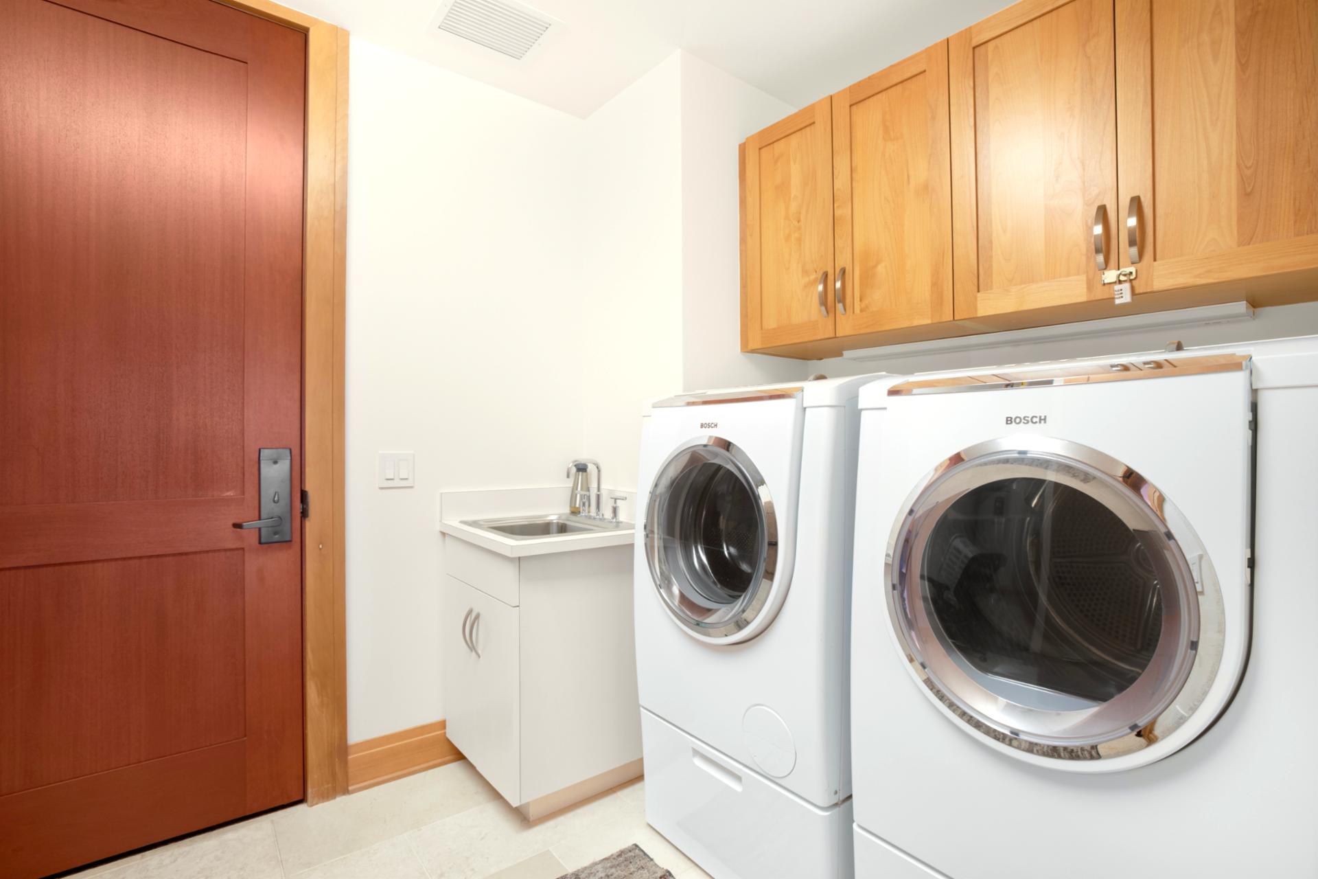 Whether you’re staying for a few days or a few weeks, this modern laundry setup offers comfort and convenience.   
