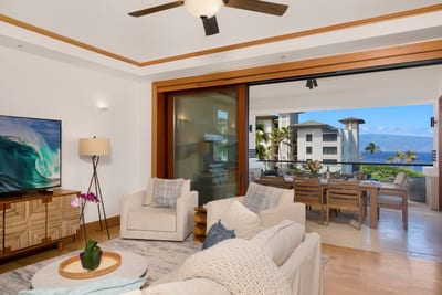 With soft hues, plush seating, and the sea sparkling beyond the glass, this living room redefines relaxation MON-6301