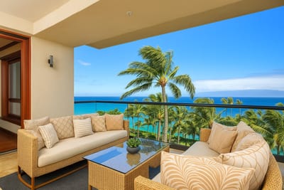 Wrapped in soft sunshine and framed by the sea’s endless hues, this lanai is a floating daydream with a front-row view