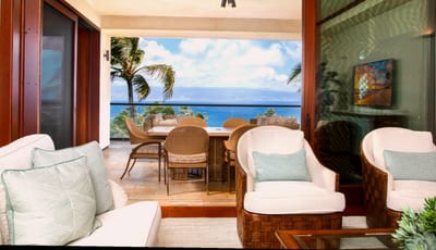 Watch the palm fronds dance against the bluest sky as ocean waves whisper tales only the breeze can truly translate