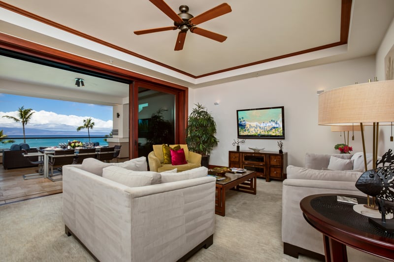 Spacious living room with full ocean views opens directly onto the lanai MON-1303