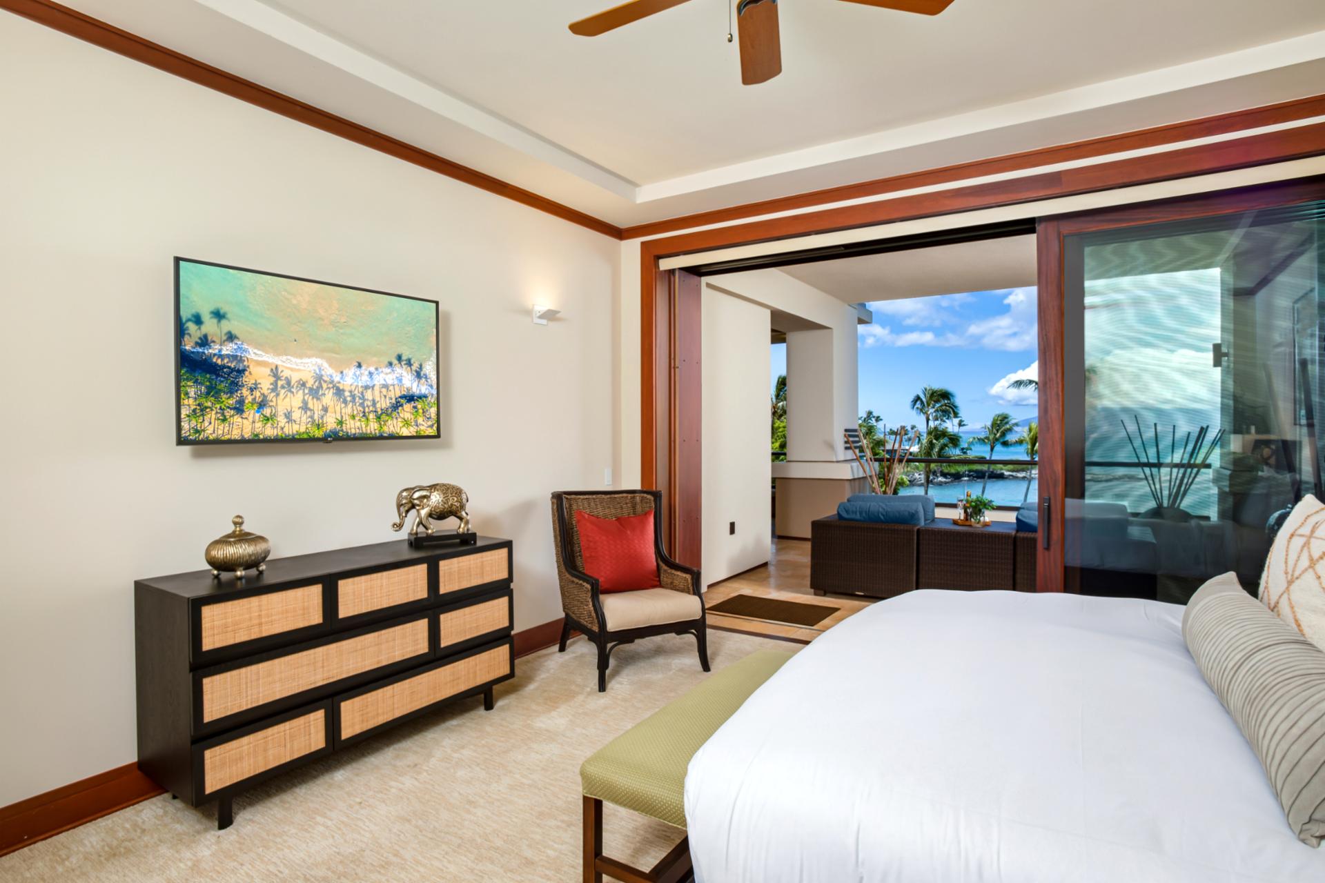 Spacious master suite with island-inspired decor and ample sunlight