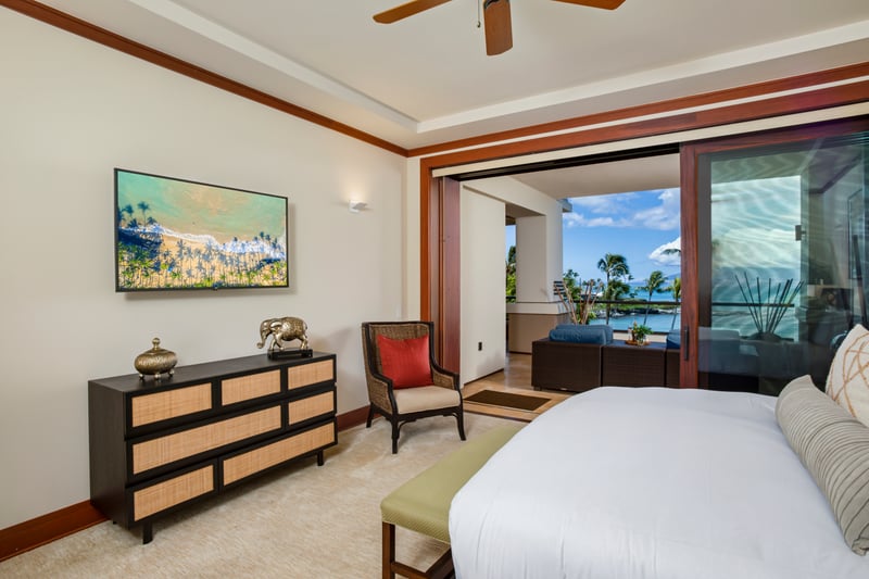 Spacious master suite with island-inspired decor and ample sunlight MON-1303