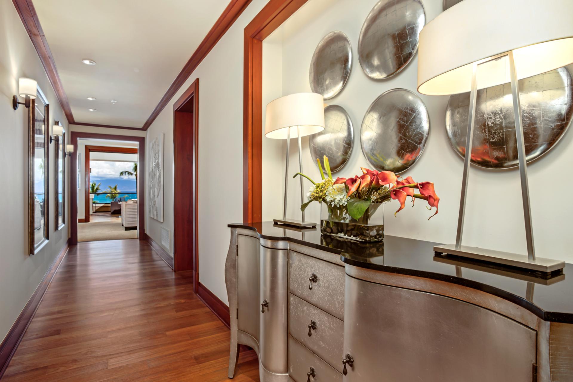 Bright hallway with artful details welcomes you into the heart of the villa