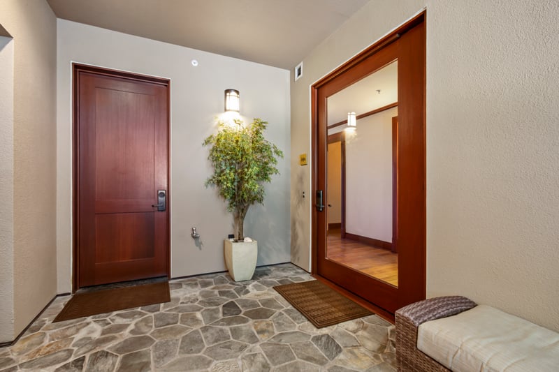 Step into your Maui escape through this inviting entryway with warm wood and natural stone MON-1303