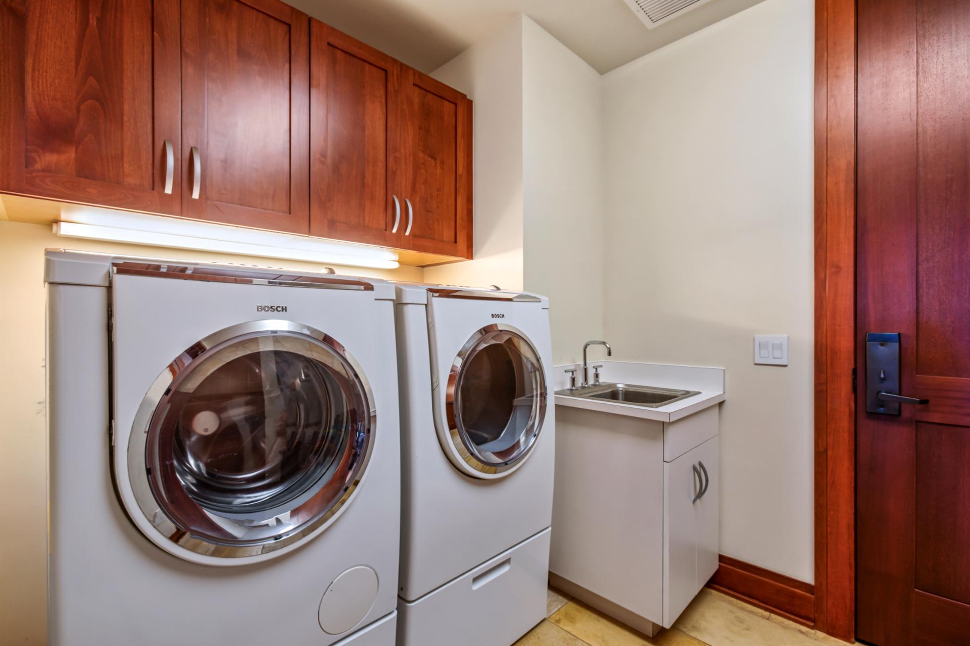 Convenient in-villa laundry room with modern washer and dryer, perfect for extended stays