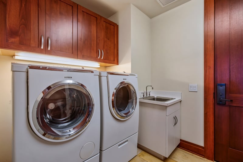 Convenient in-villa laundry room with modern washer and dryer, perfect for extended stays MON-1303