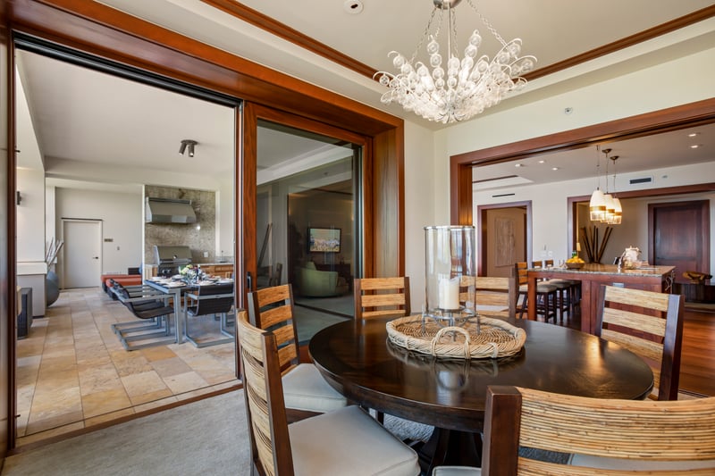 Chic dining room with glass doors opening to a breezy balcony MON-1303