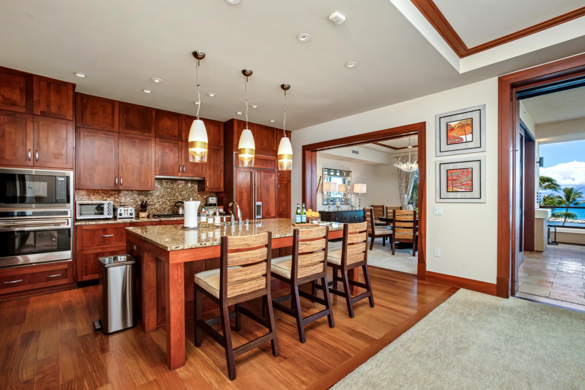 Fully equipped gourmet kitchen opens to the dining area for easy entertaining