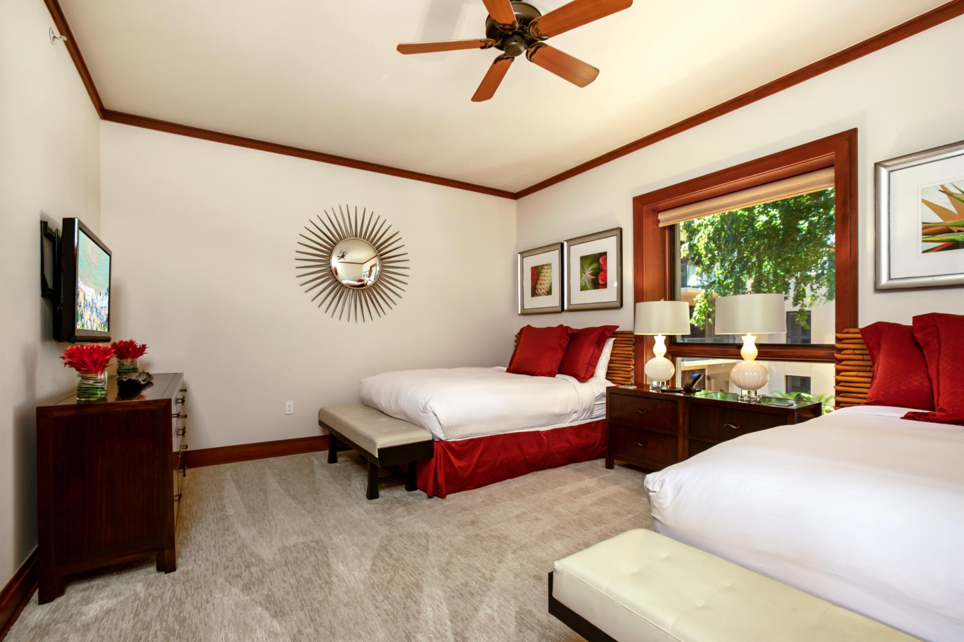 Spacious and welcoming, this guest room offers comfort and vibrant island charm