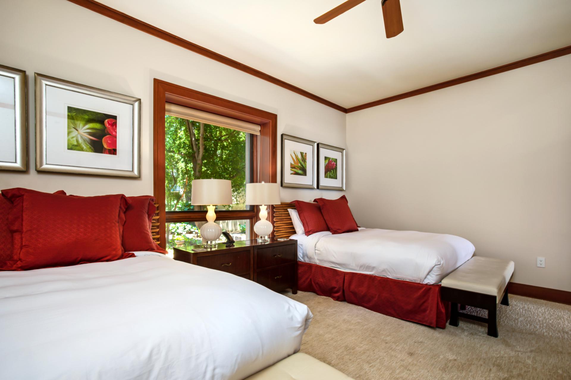 This queen bed guest suite is bright, cheerful, and perfect for family stays