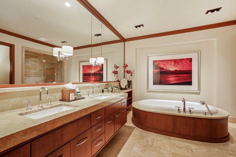 Indulge in spa-like luxury with a deep soaking tub and marble finishes MON-1303