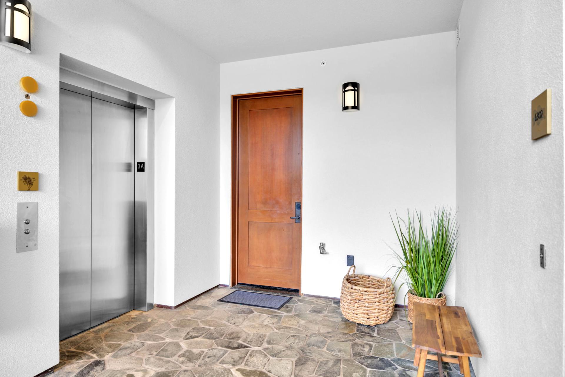 Entry with elevator access and breezy tropical styling