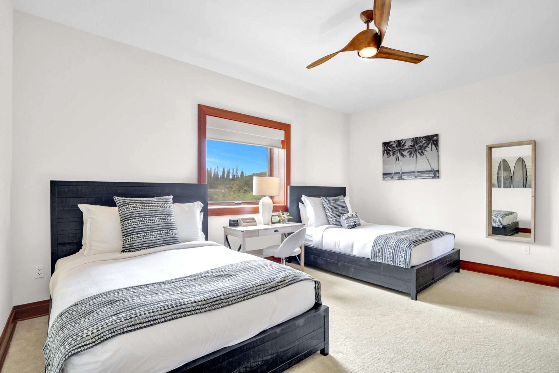 Guest room two with spacious layout and charming tropical decor