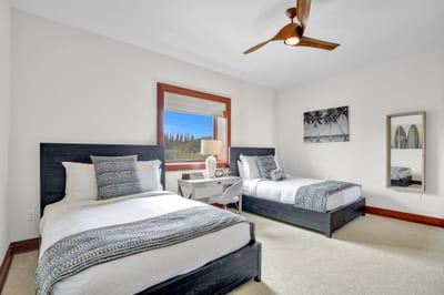 Guest room two with spacious layout and charming tropical decor