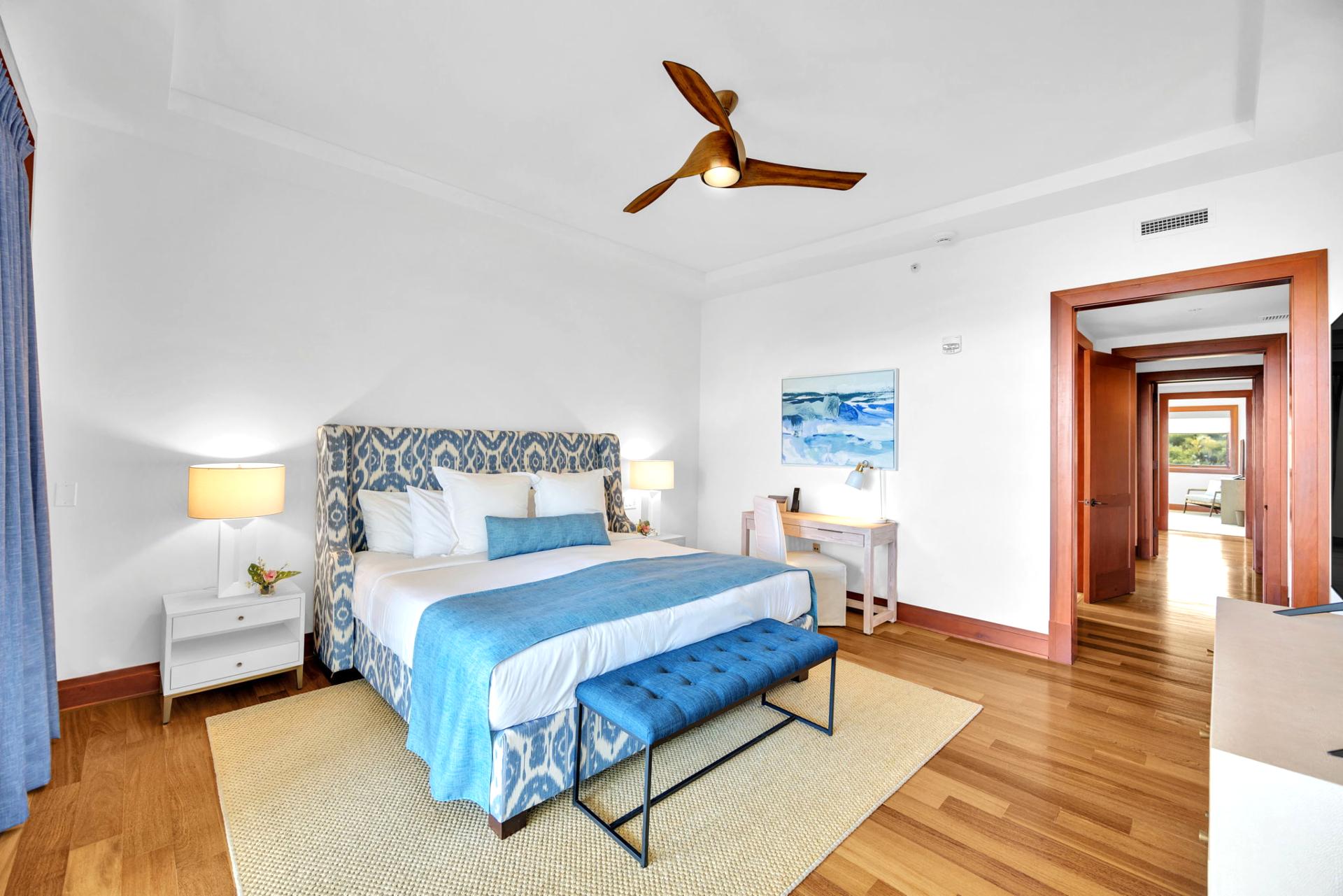 Elegant master retreat with designer headboard and warm natural light