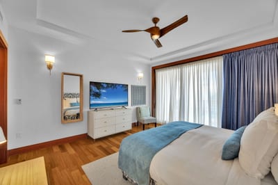 Spacious master suite with soft tones and coastal decor for restful nights