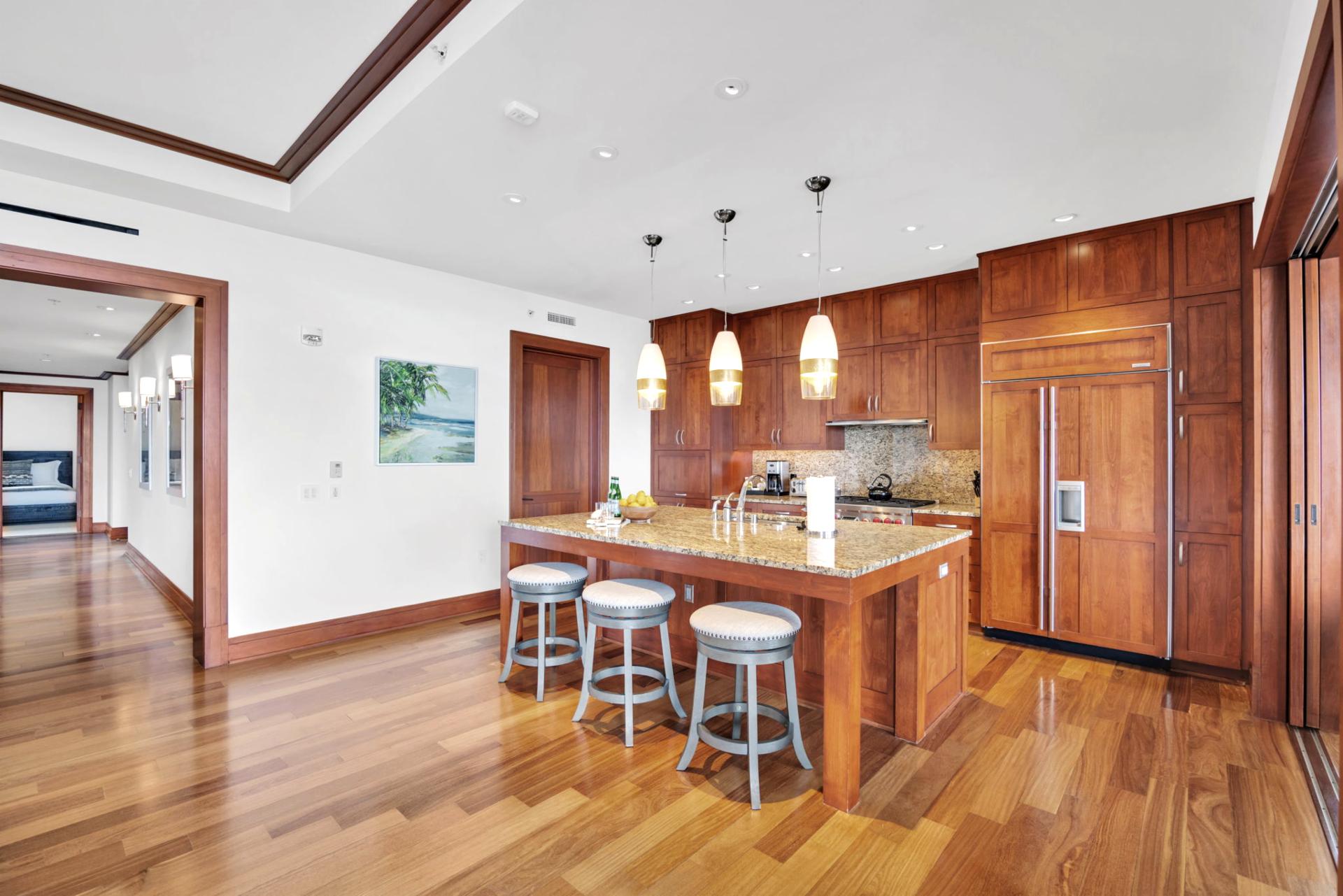 Kitchen and island bar ready for breakfast spreads or evening wine prep