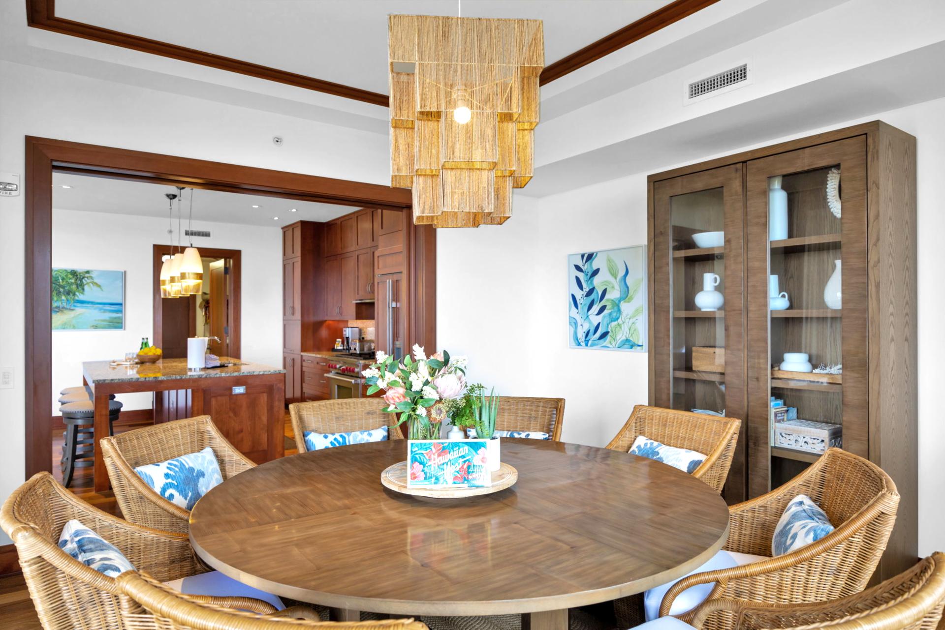 Beautiful woven dining chairs and wood table perfect for tropical gatherings or family dinner