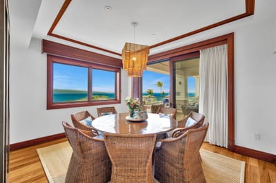 Dining area with natural textures and ocean-facing windows for vibrant meals