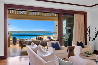 Elegant living room with retractable doors for seamless indoor-outdoor flow