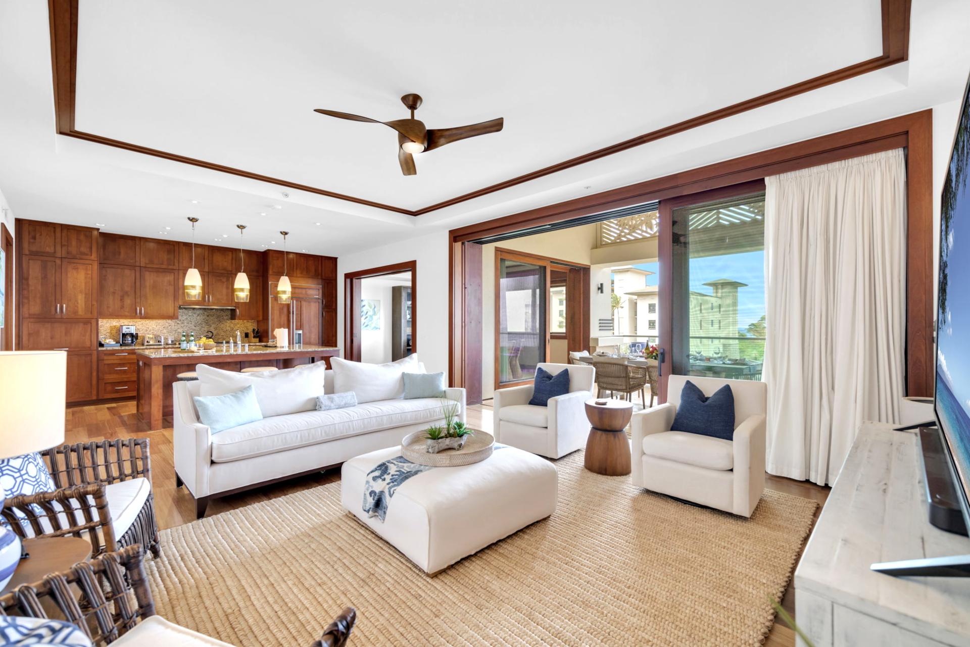 Spacious living room with warm wood tones and stylish island decor
