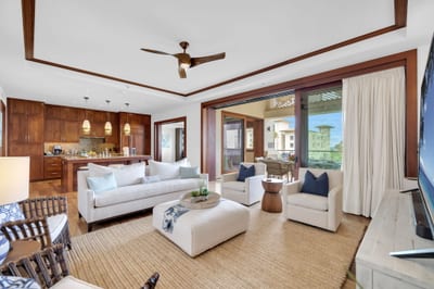 Spacious living room with warm wood tones and stylish island decor