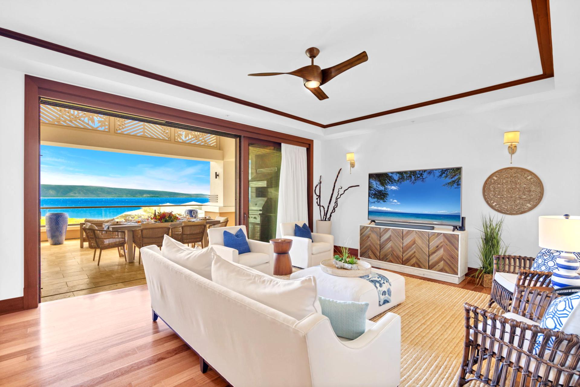 Bright living area with cozy seating and ocean outlook