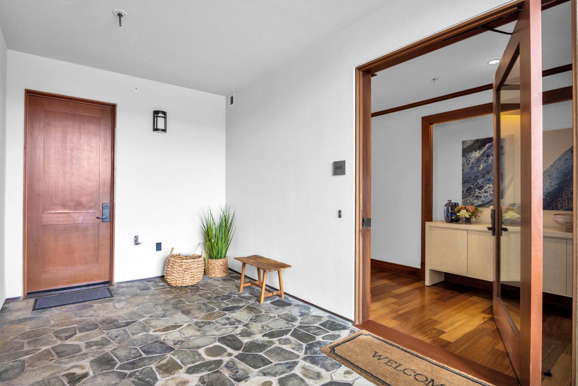 Entry hallway with stone tile and accents for a relaxed welcome