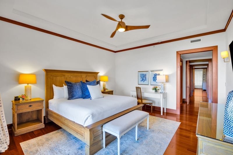 The master bed features a comfortable king size bed and private workspace