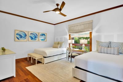 The second guest bedroom features two queen size beds, perfect for children or additional guests