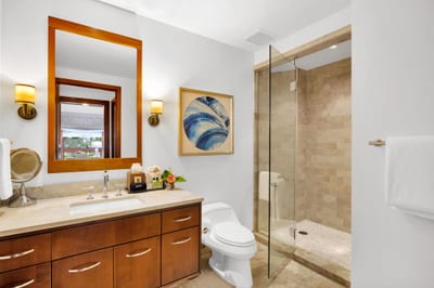 Glass-enclosed shower with elegant tile work