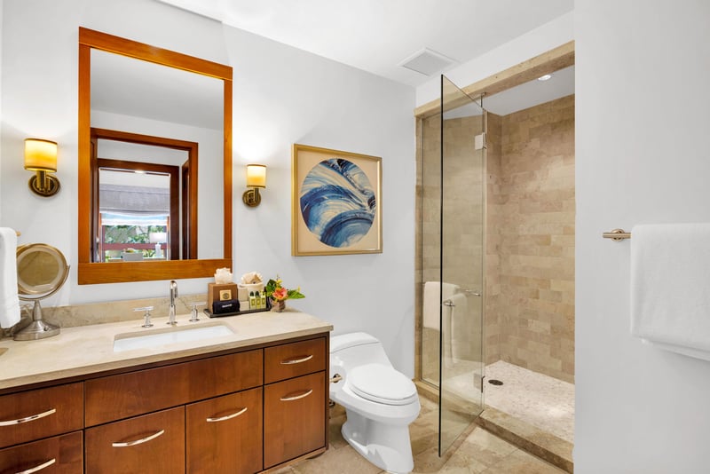 Glass-enclosed shower with elegant tile work