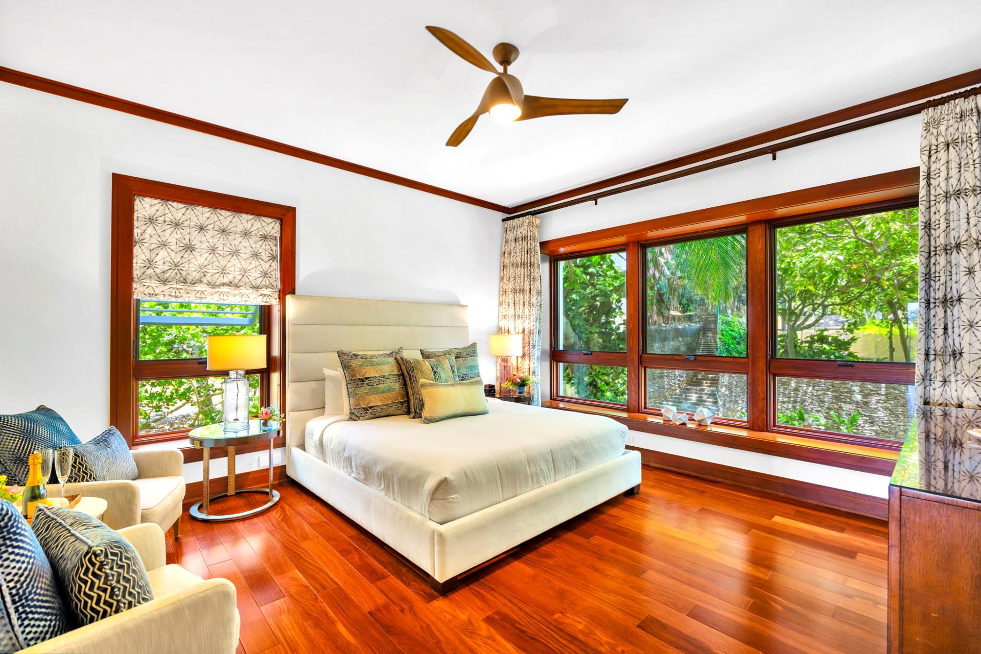 Guest bedroom with natural light and garden views