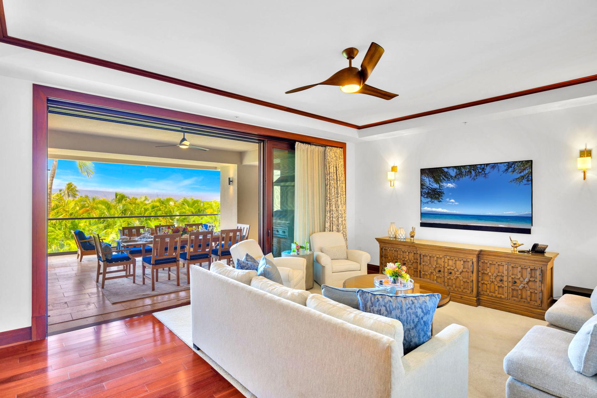 The bright and airy living room features wood accents and different lighting options to enhance your stay
