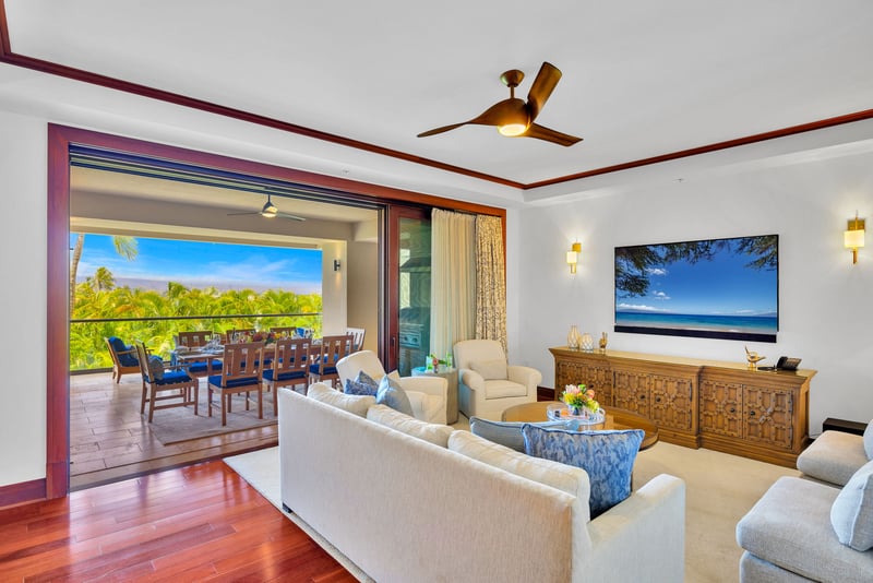 The bright and airy living room features wood accents and different lighting options to enhance your stay