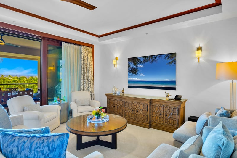 The spacious living area features plush furnishings, perfect for unwinding