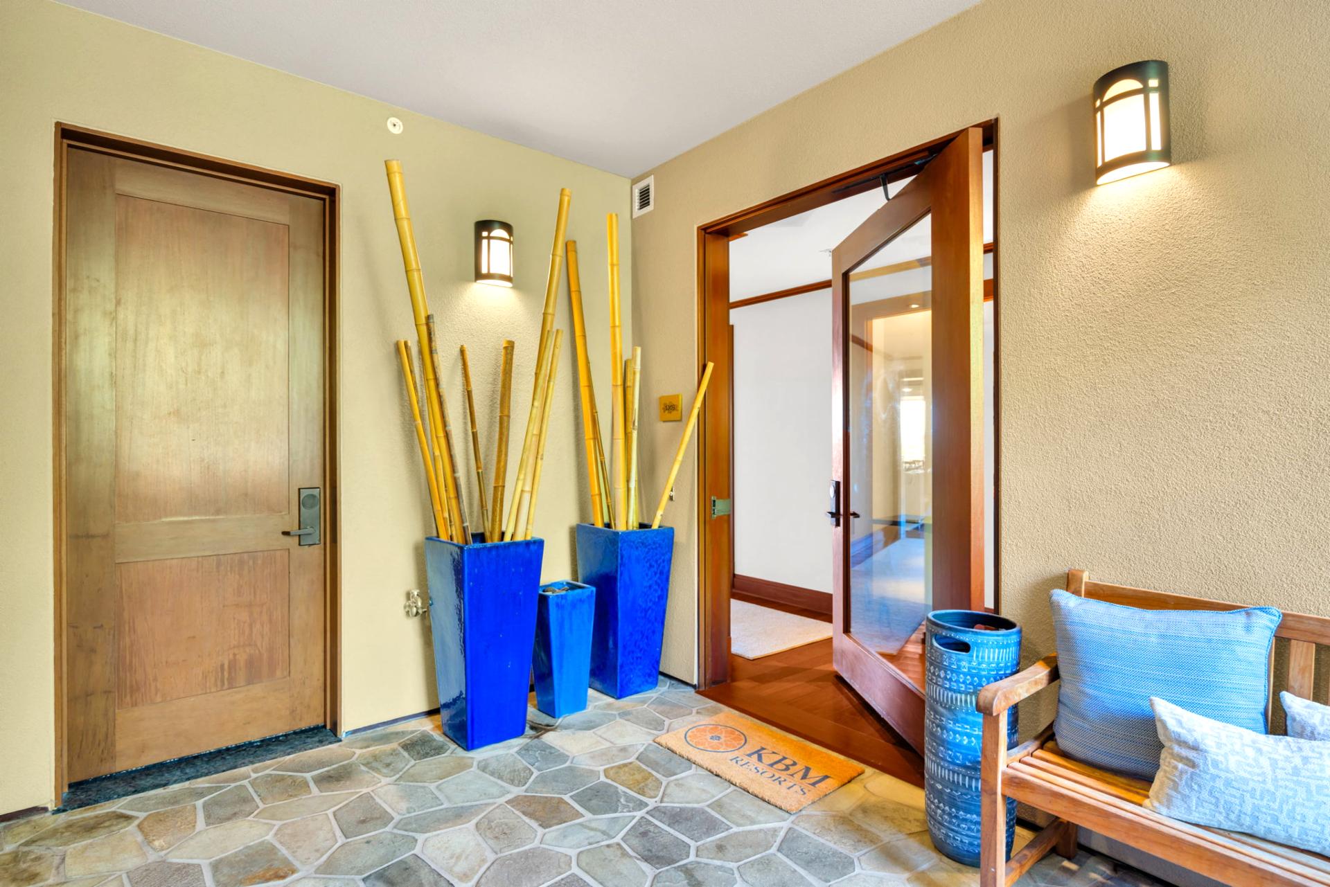 The welcoming entryway features tropical decor 