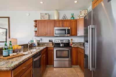 Enjoy a fully equipped kitchen with wood cabinetry and ample space
NAP-B13