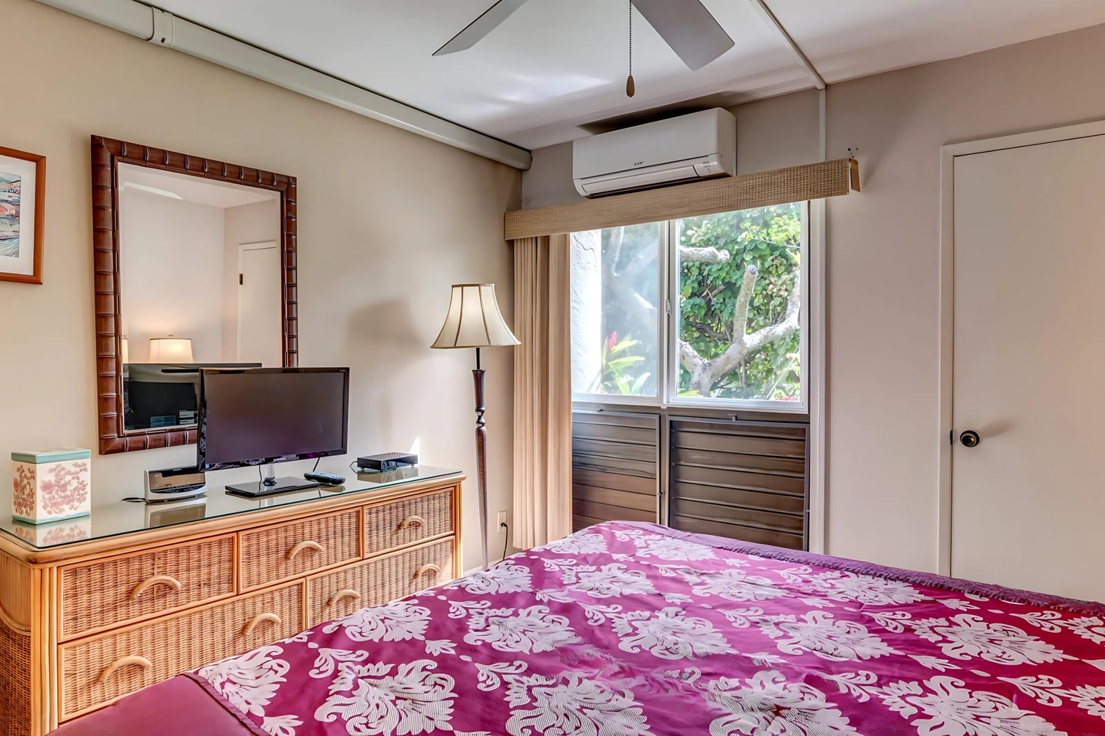 This bright master suite boasts a king bed, large windows with garden views, and tropical decor to match your Hawaiian getaway. NAP-B43