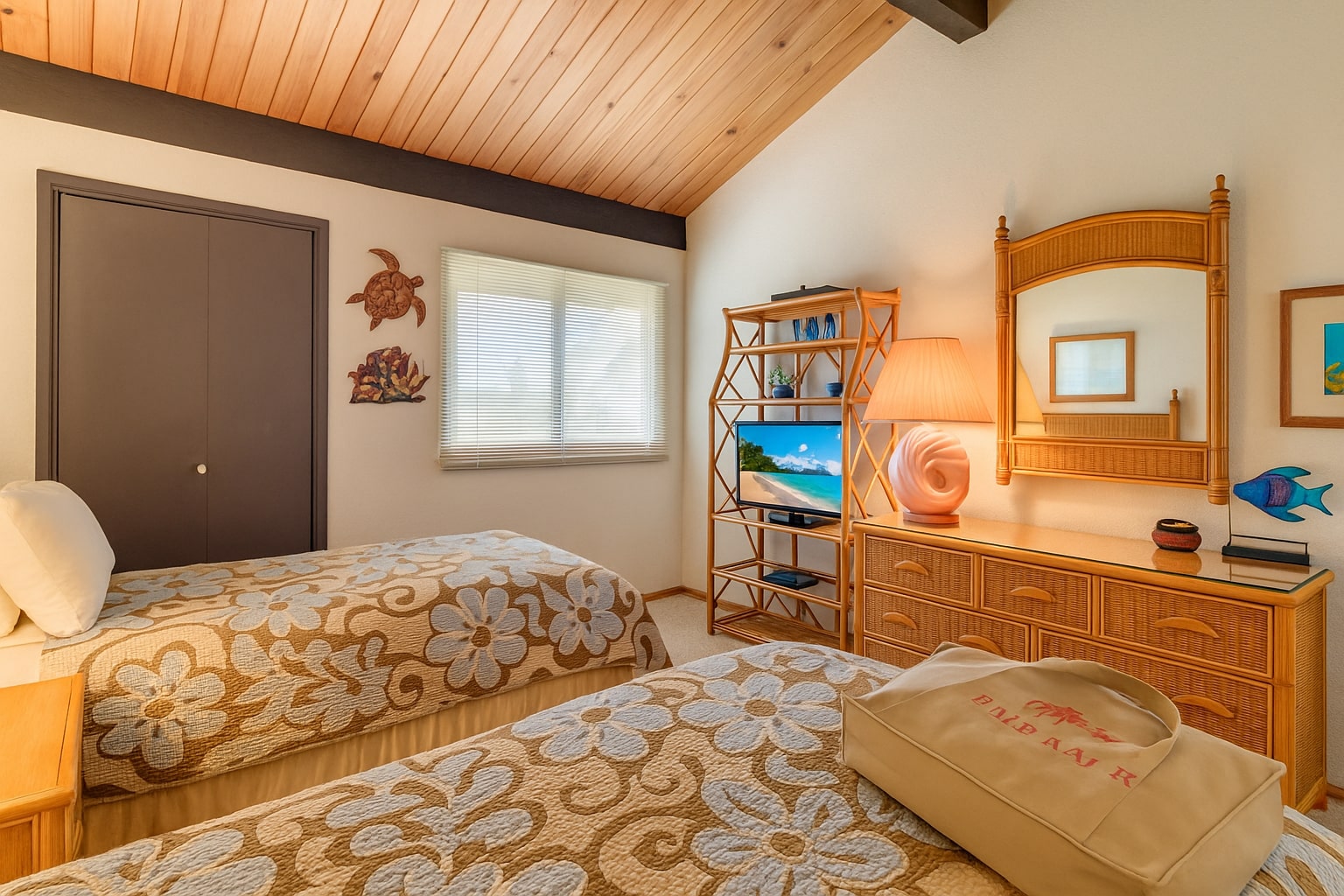Charming guest room with twin beds, wood-beam ceilings, tropical rattan furniture, and vibrant island artwork     NAP-C42