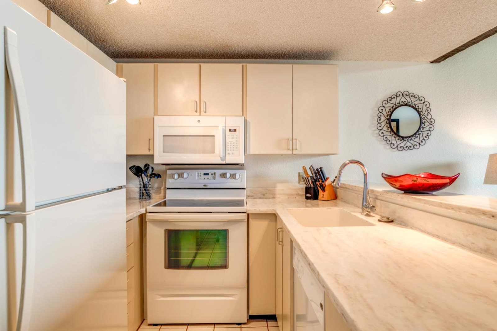     Cozy Kitchen with Classic White Appliances and Marble Countertops NAP-C42