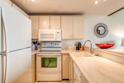 Cozy Kitchen with Classic White Appliances and Marble Countertops NAP-C42